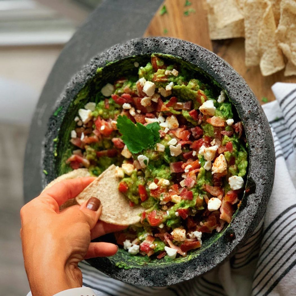 Guacamole with bacon, goat cheese, and maple-chipotle drizzle